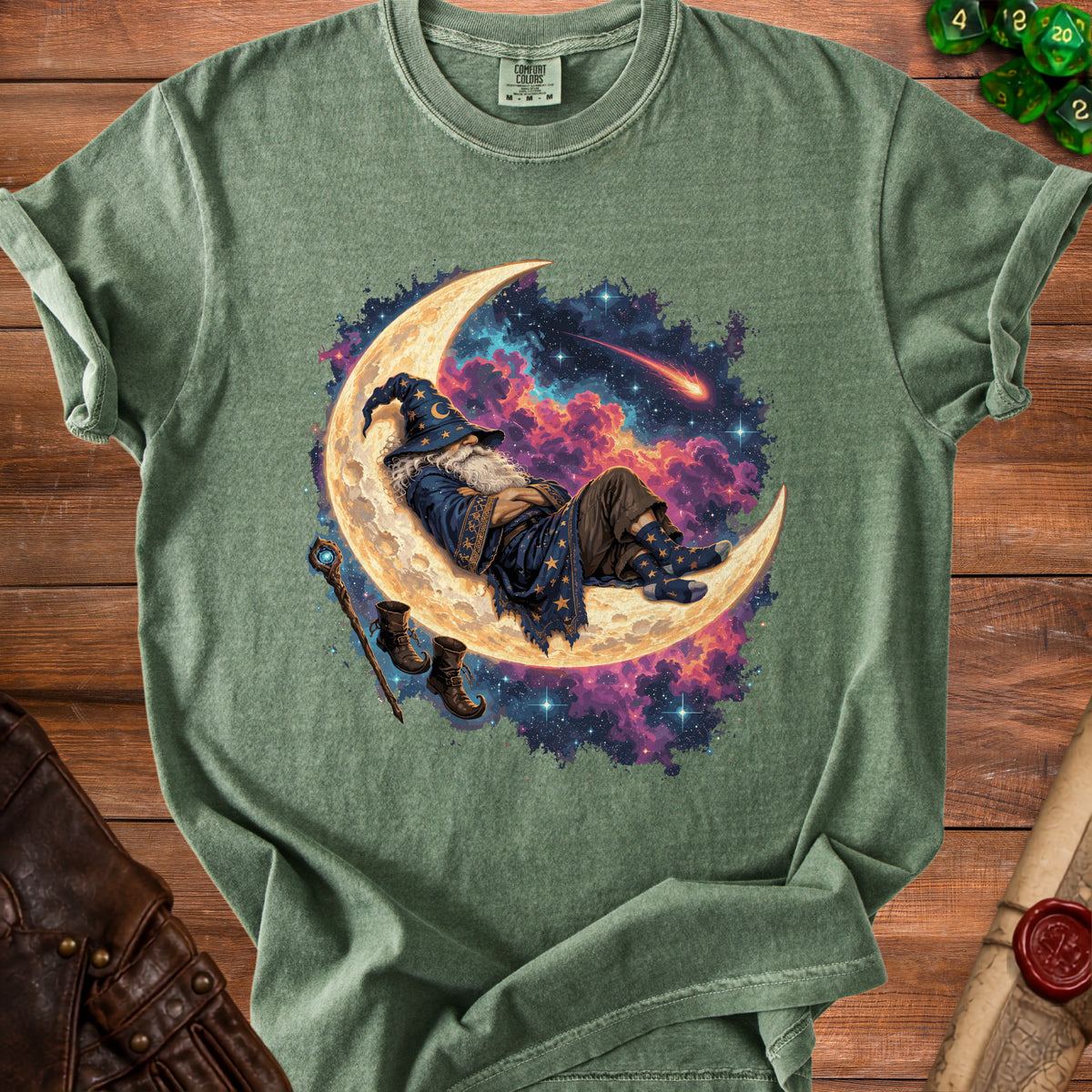 Green t-shirt with wizard sleeping on a crescent moon in a starry sky.