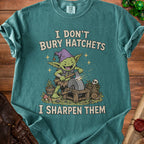 Goblin sharpening a hatchet with text "I don't bury hatchets, I sharpen them."