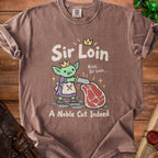 Brown t-shirt with a cartoon goblin and steak design, reading "Sir Loin" and "A Noble Cut Indeed".