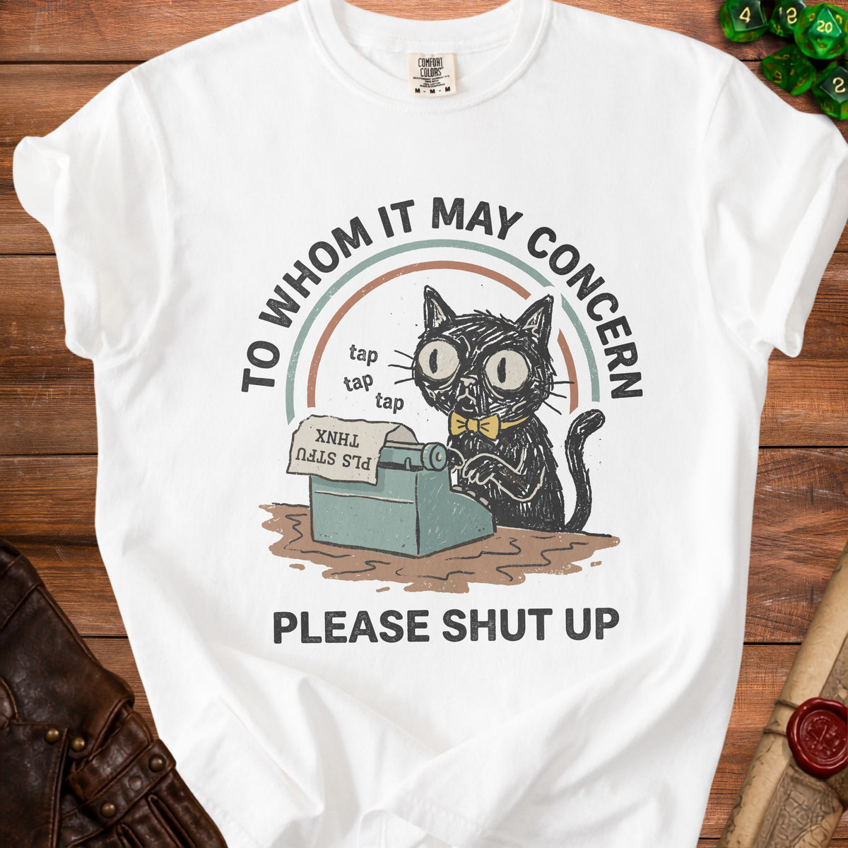 White t-shirt with black cat at typewriter, "To Whom It May Concern" and "Please Shut Up."