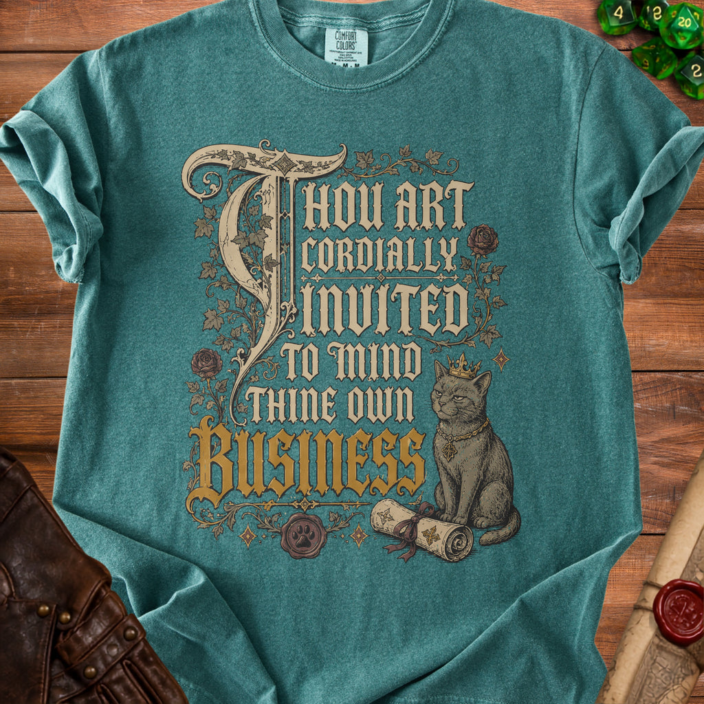 Teal t-shirt with "Thou Art Cordially Invited To Mind Thine Own Business" and a crowned cat.