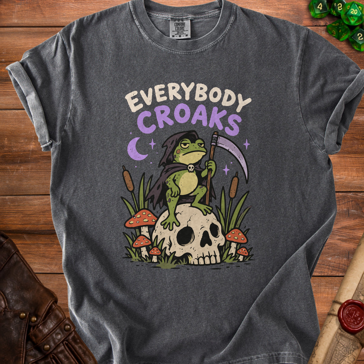 Dark grey t-shirt with a grim reaper frog on a skull design and text "Everybody Croaks".