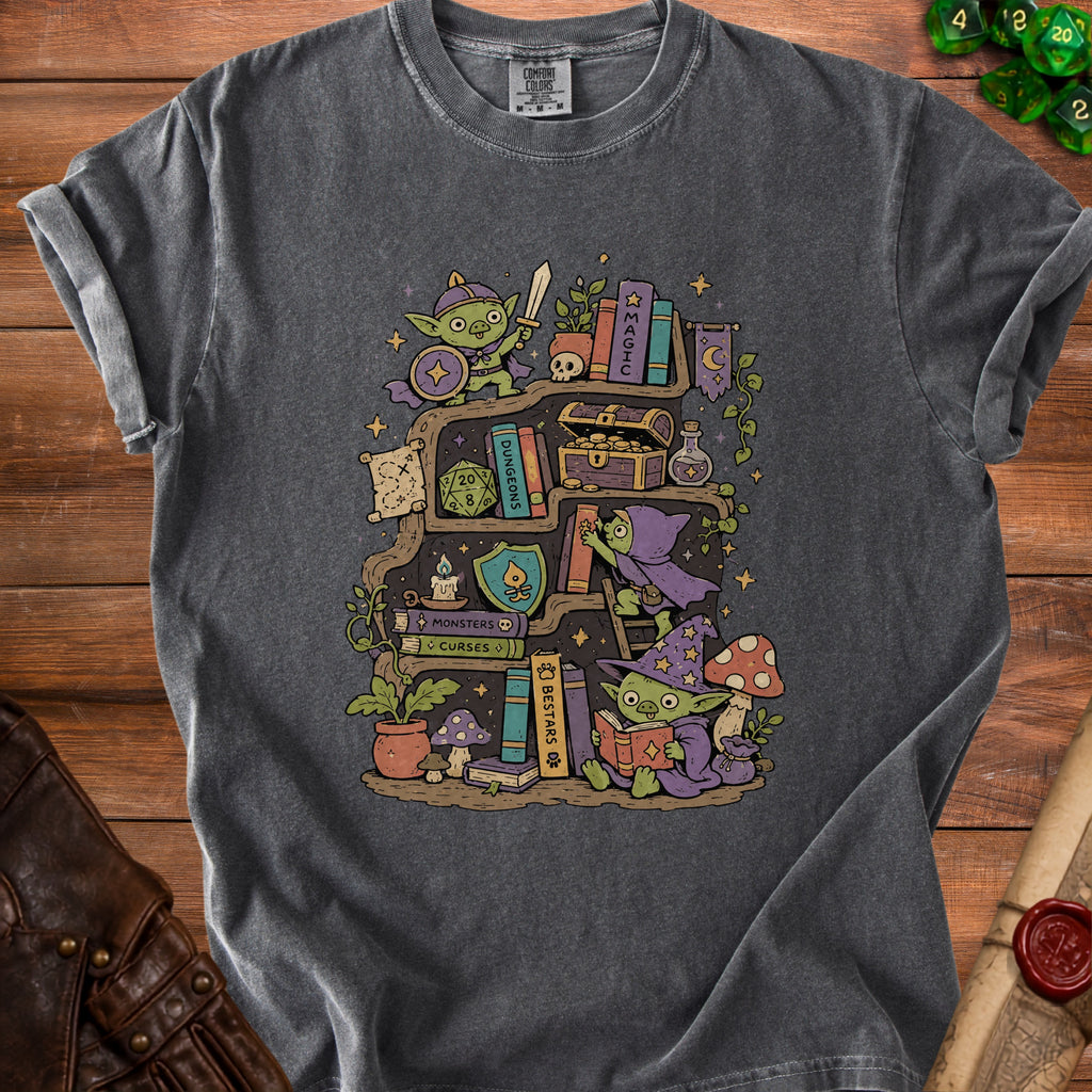 T-shirt graphic of goblins on a bookshelf with Dungeons & Dragons items.