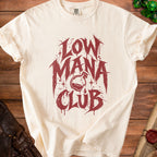 Cream t-shirt with maroon "Low Mana Club" graphic featuring a potion bottle.