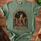 Green t-shirt with illustration of a crowned woman and text "Dress for the job you want. Who says I want a job?".