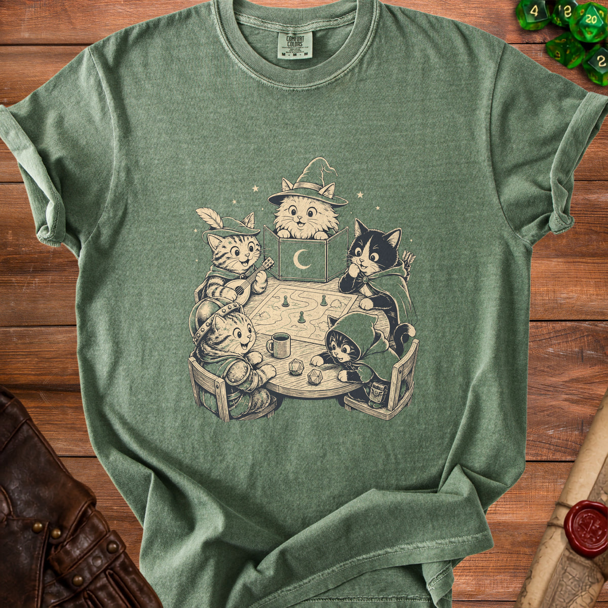 Green t-shirt with cartoon cats playing a tabletop role-playing game.