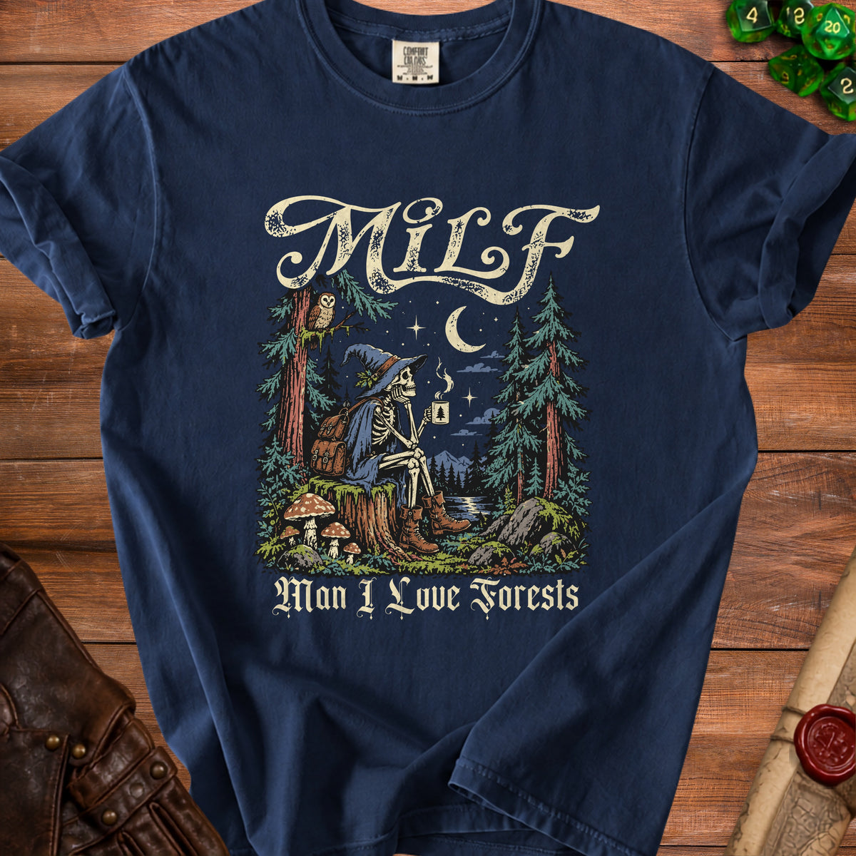 T-shirt with skeleton in wizard hat holding coffee in forest, text "MILF Man I Love Forests".
