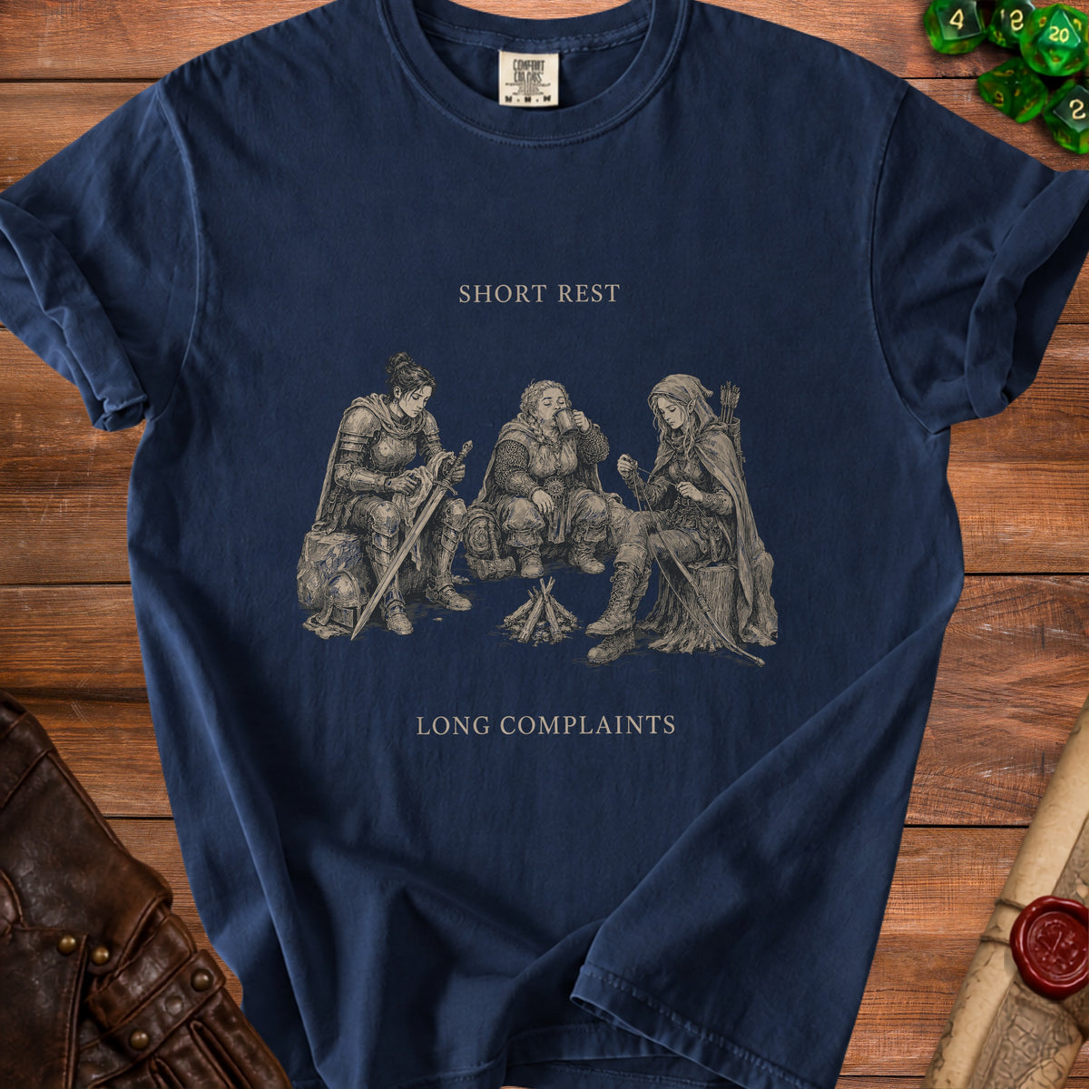 Dark blue t-shirt with an illustration of three fantasy characters around a campfire.