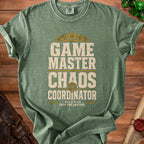 Green t-shirt with "Game Master Chaos Coordinator" text and dice design.