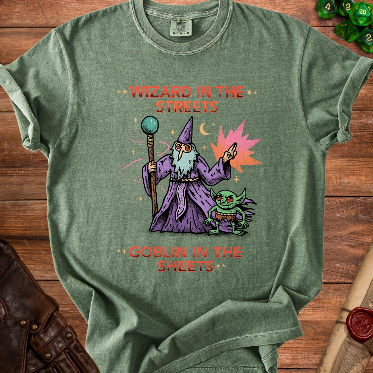 Green t-shirt with wizard and goblin illustration and text "WIZARD IN THE STREETS GOBLIN IN THE SHEETS".