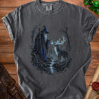 T-shirt with wizard and stag in forest scene, with cascading water and glowing lantern.
