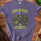 Purple t-shirt with goblins, toad, and text "LEAVE NO TRASH THE GOBLINS ARE JUDGING YOU".