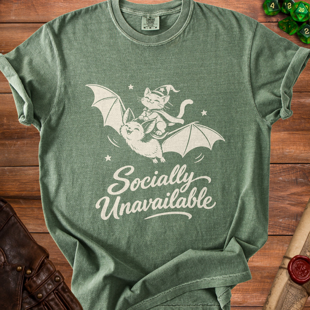 Green t-shirt with a cat riding a bat, saying "Socially Unavailable".
