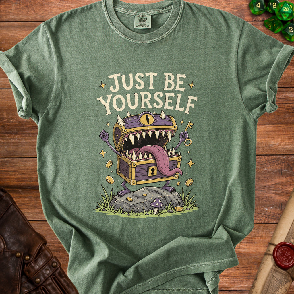 Green t-shirt with "JUST BE YOURSELF" text and a monster chest graphic.
