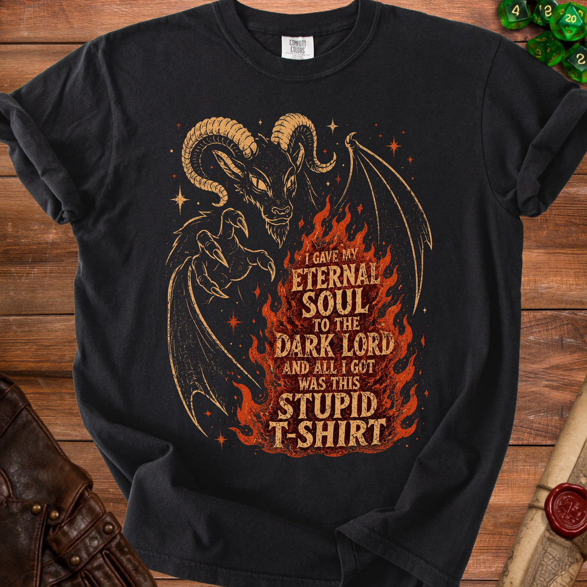 Black t-shirt with a demon and flames graphic that reads "I gave my eternal soul to the dark lord and all I got was this stupid t-shirt."