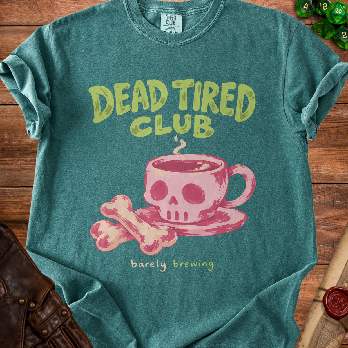 Teal t-shirt with "Dead Tired Club" and skull coffee cup graphic.