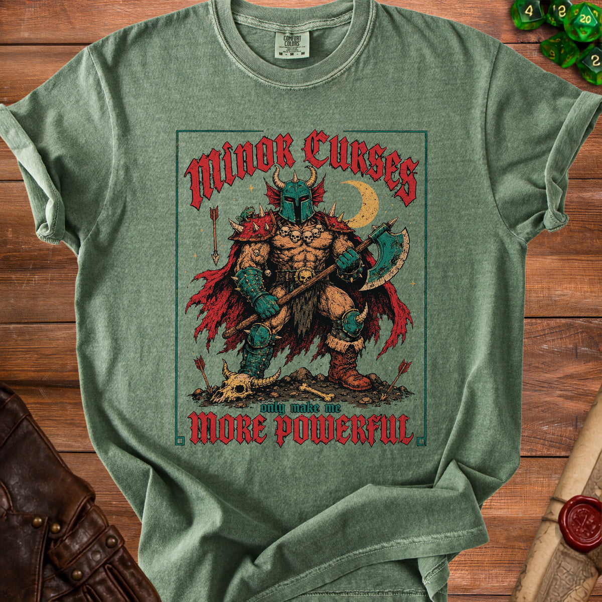 Green t-shirt with "Minor Curses only make me MORE POWERFUL" text and barbarian graphic.