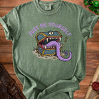 Green t-shirt with purple text "JUST BE YOURSELF" and a monster chest graphic.