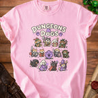 Pink t-shirt with "Dungeons & Dogs" and cartoon dogs in fantasy roles.