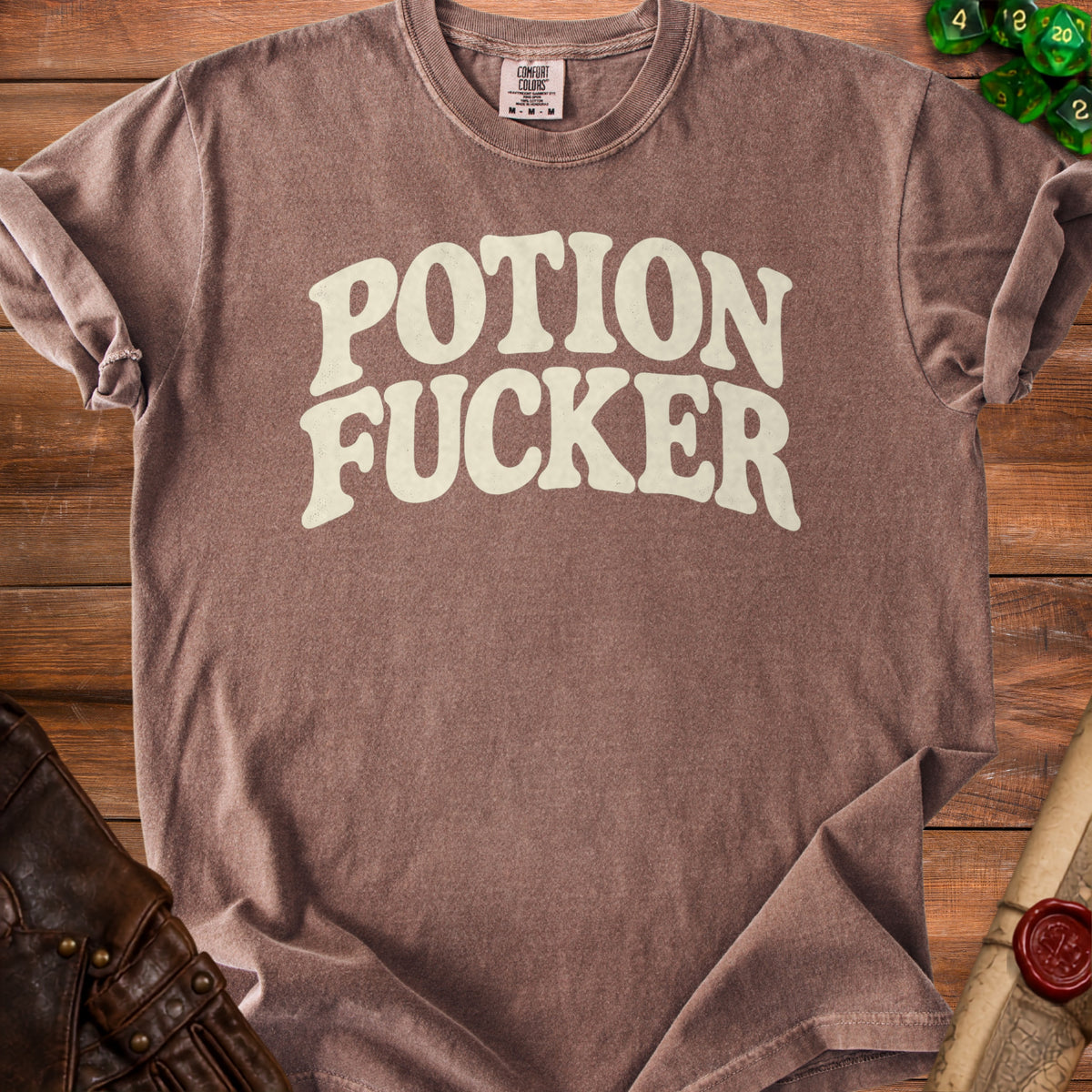 Brown t-shirt with "Potion Fucker" text in distressed cream lettering.