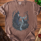 Brown t-shirt with a fantasy graphic of a wizard and a stag by a waterfall.
