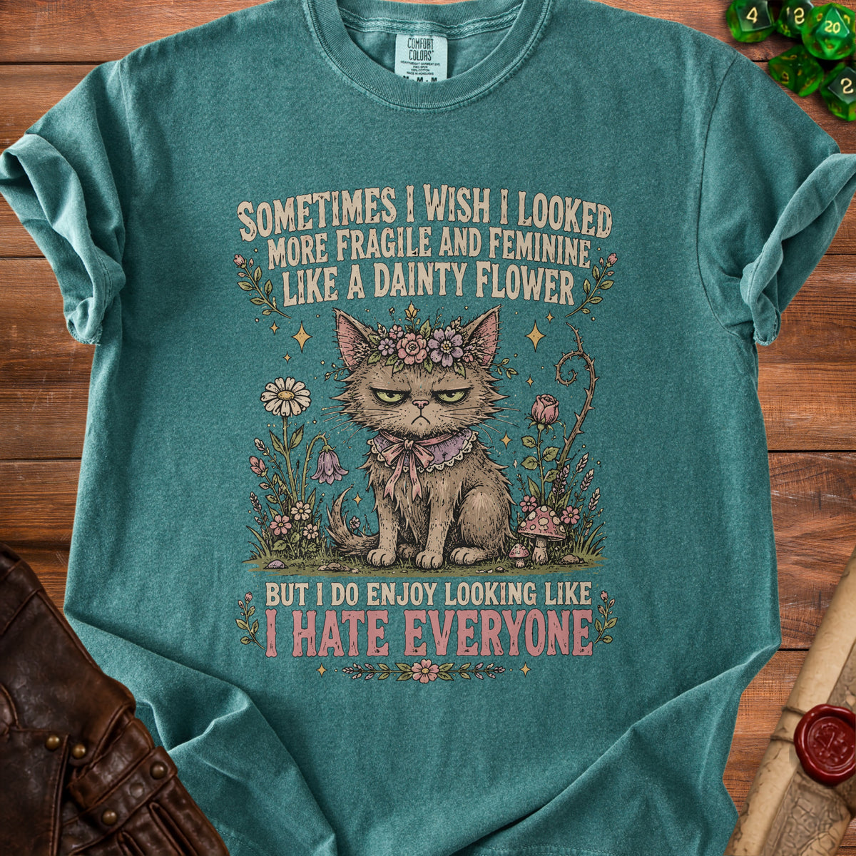 Grumpy cat with floral crown says "I hate everyone" on teal t-shirt.