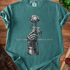 Teal t-shirt with knight's gauntlet holding a rose with text "HELD TOGETHER BY BOWS & SPITE".