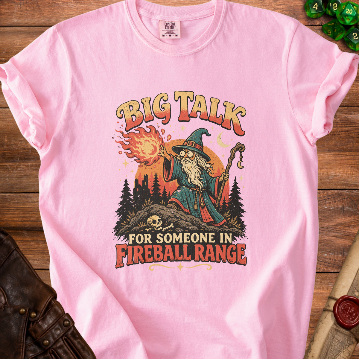 Pink t-shirt with "Big Talk For Someone In Fireball Range" and wizard graphic.