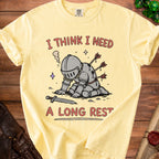 Yellow t-shirt with knight graphic and text "I THINK I NEED A LONG REST."