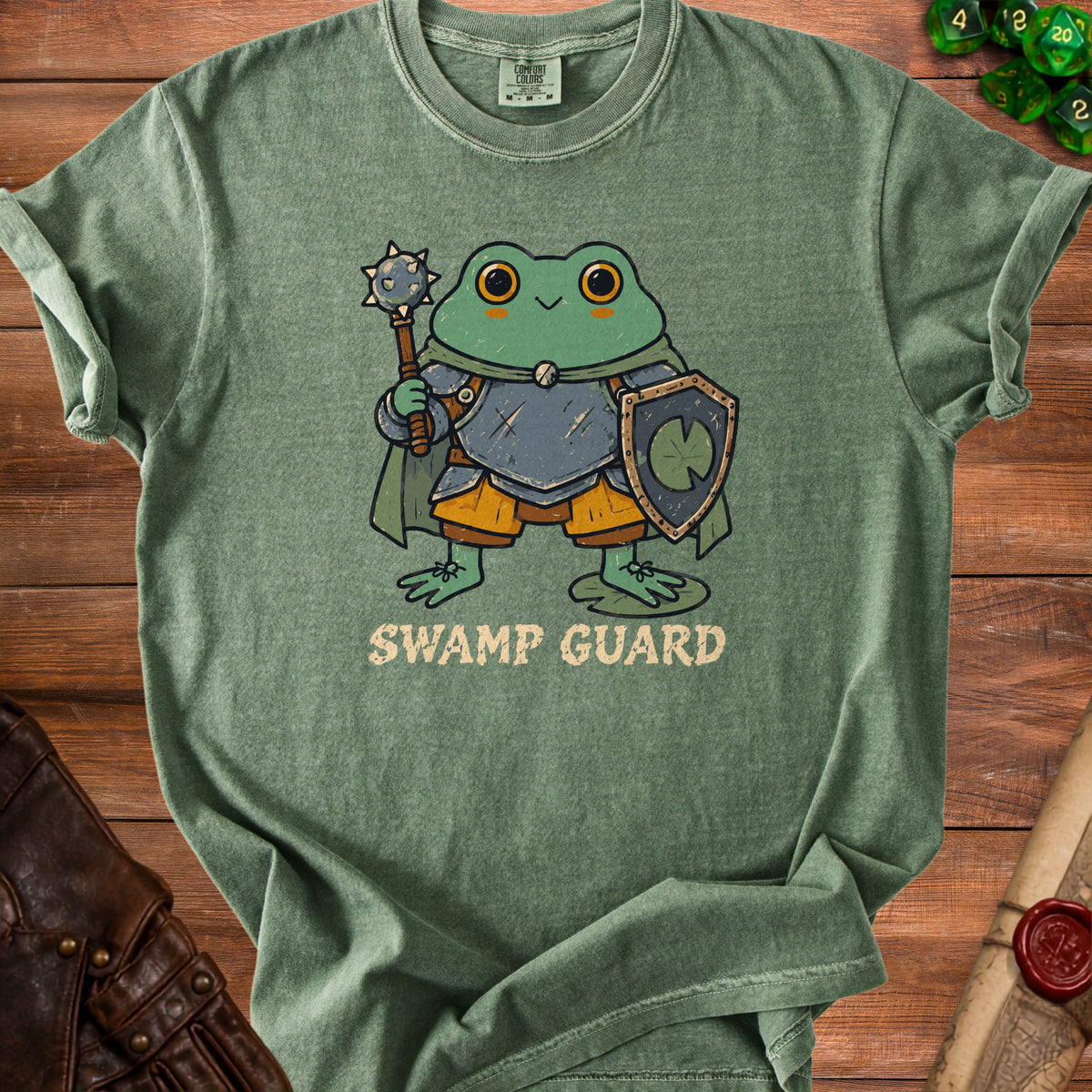 Green t-shirt with a cartoon frog knight and the text "Swamp Guard".