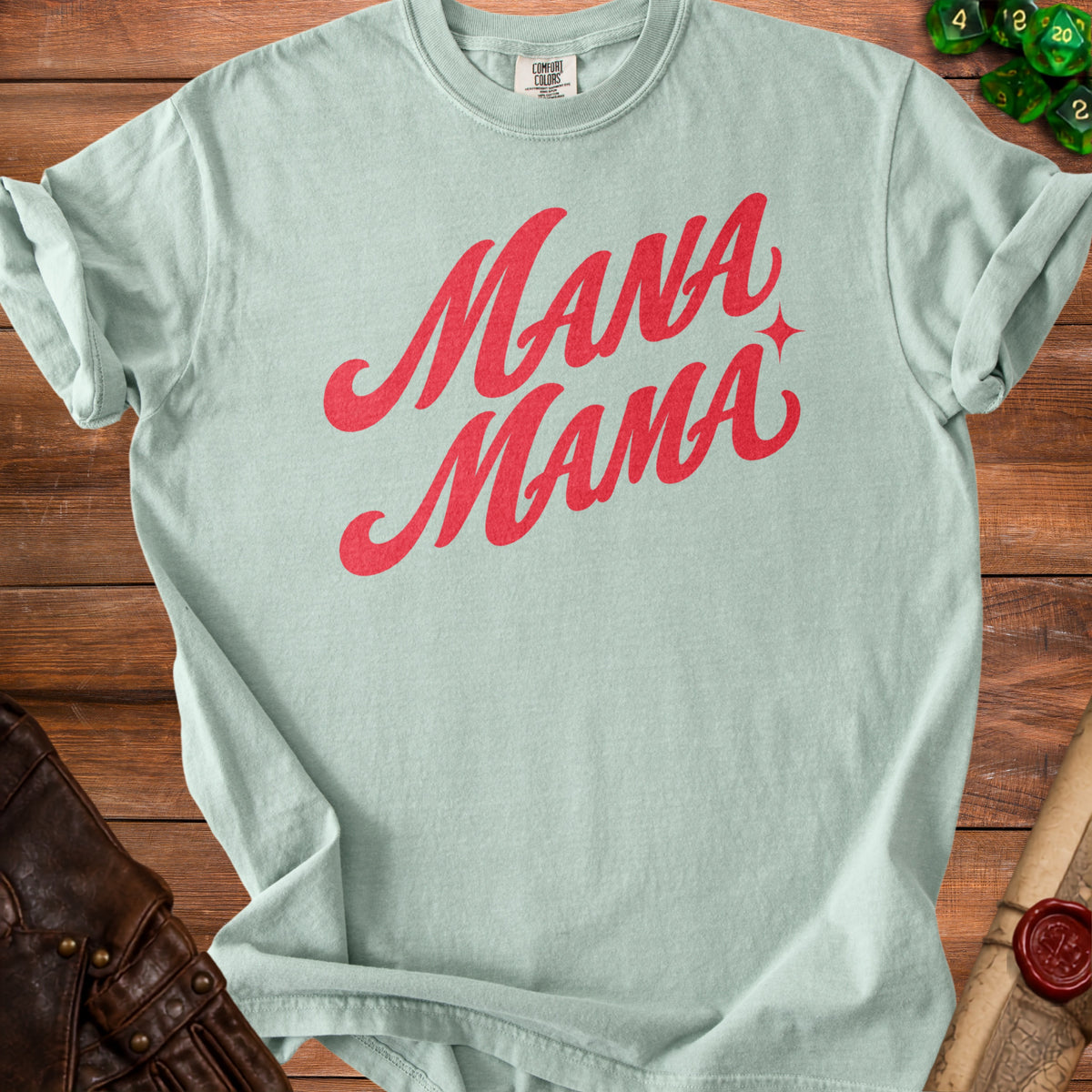 Light green t-shirt with red "Mana Mama" script and star graphic.
