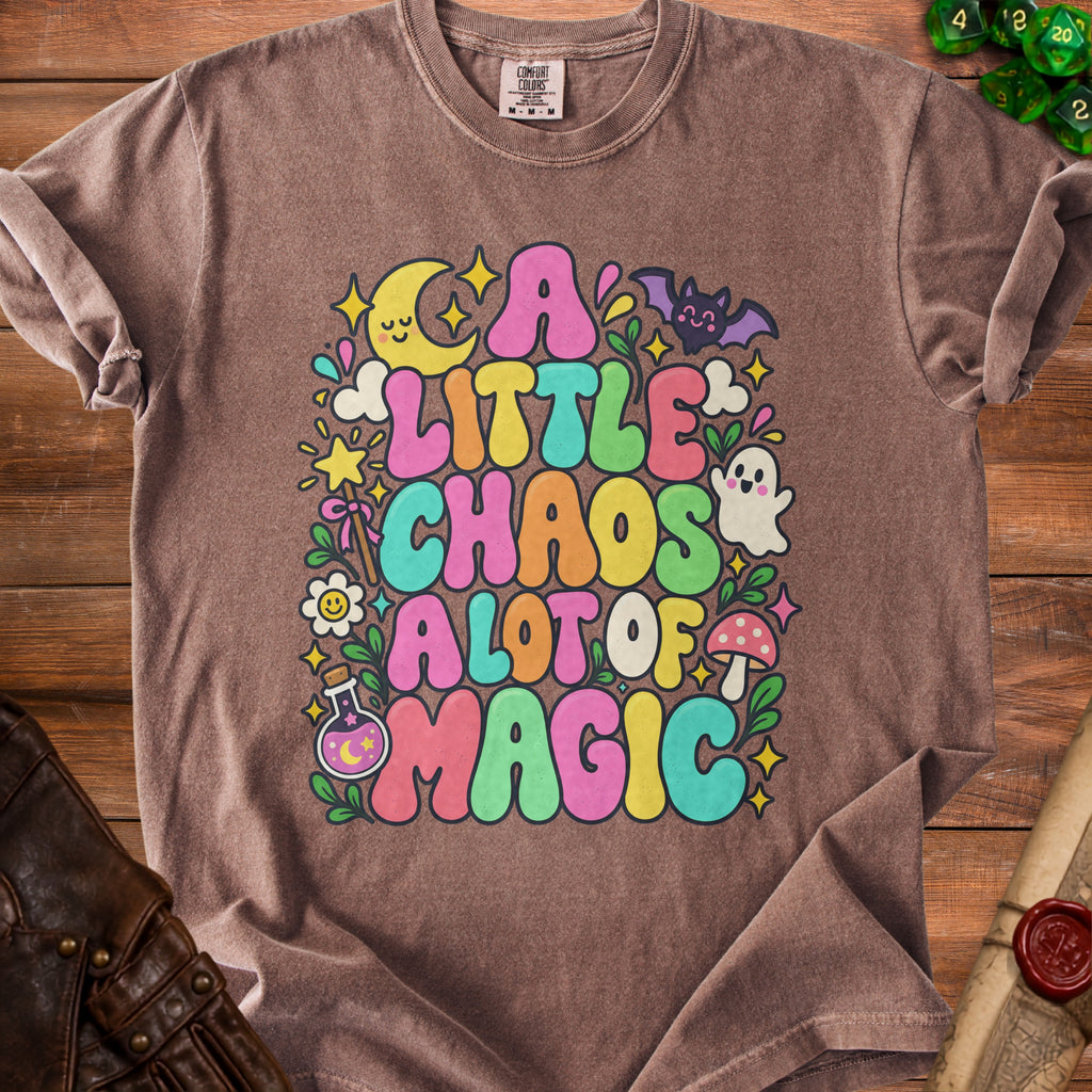 Brown t-shirt with colorful graphic reading "A Little Chaos A Lot of Magic."