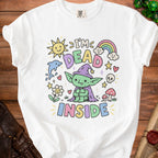 White t-shirt with "I'm Dead Inside" text and cartoon goblin, sun, rainbow, and dolphin.