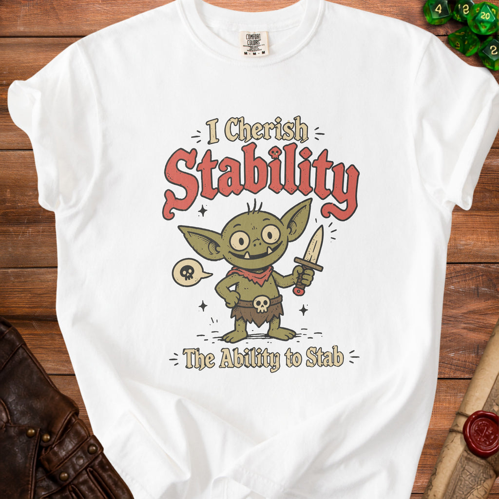 White t-shirt with a cartoon goblin holding a dagger and text "I Cherish Stability - The Ability to Stab".