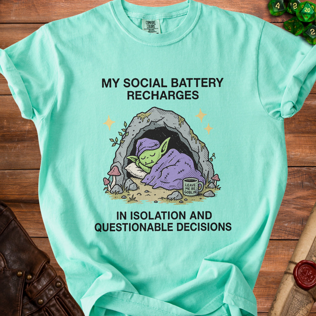 Mint t-shirt with a goblin sleeping in a cave and text about social battery.