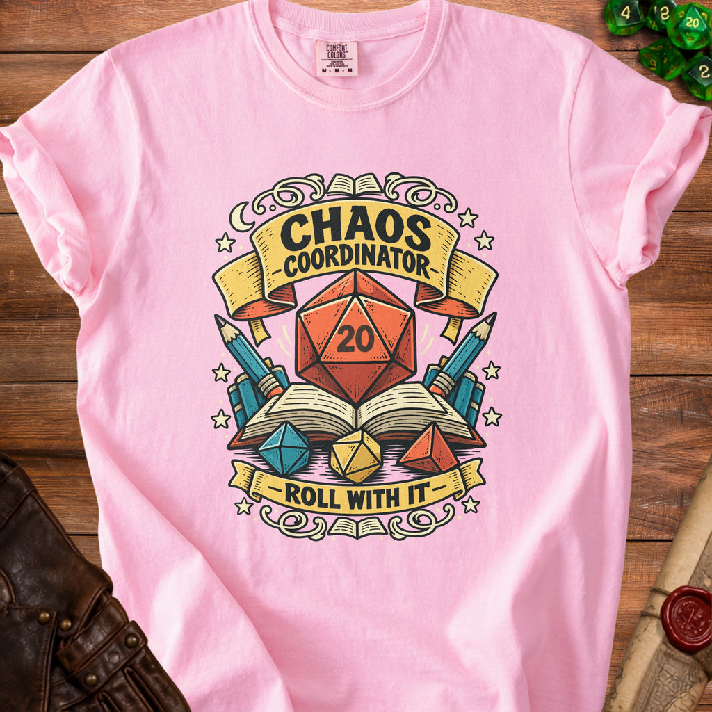 Pink t-shirt with "Chaos Coordinator Roll With It" text and D20 dice graphics.