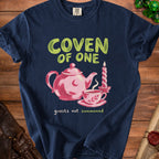 Navy t-shirt with "COVEN OF ONE guests not summoned" and teapot.