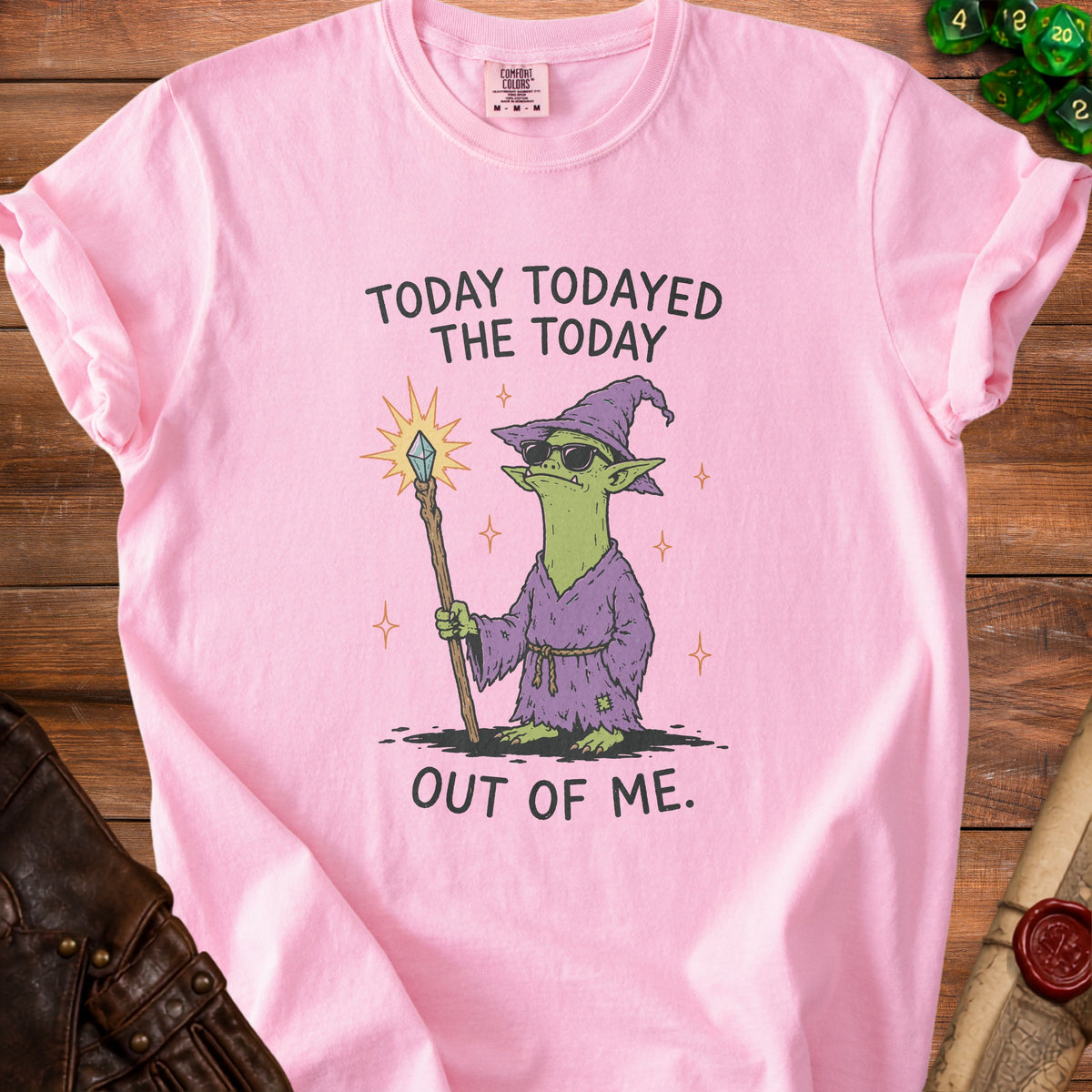 Pink t-shirt with a cartoon goblin wizard and text "Today todayed the today out of me."
