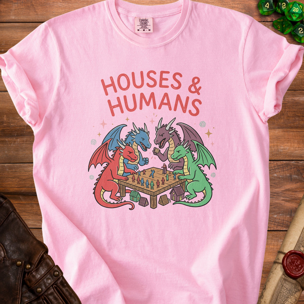 Pink t-shirt with "Houses & Humans" text and dragons playing a board game.