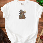 White t-shirt with embroidered wizard bear holding a book and staff.
