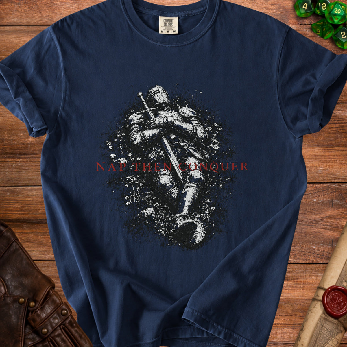Navy t-shirt with knight illustration and "Nay Then Conquer" text.