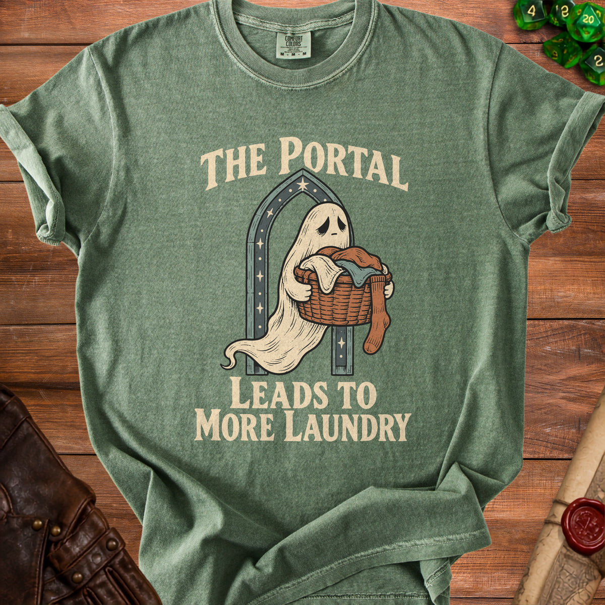 Green t-shirt with ghost carrying laundry and text "The Portal Leads to More Laundry".