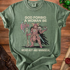 Green t-shirt with "God Forbid A Woman Be Weird Hot and Whimsical" text and warrior illustration.