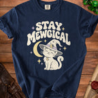 Navy t-shirt with white text "STAY MEWGICAL" above a cartoon cat in a witch hat.