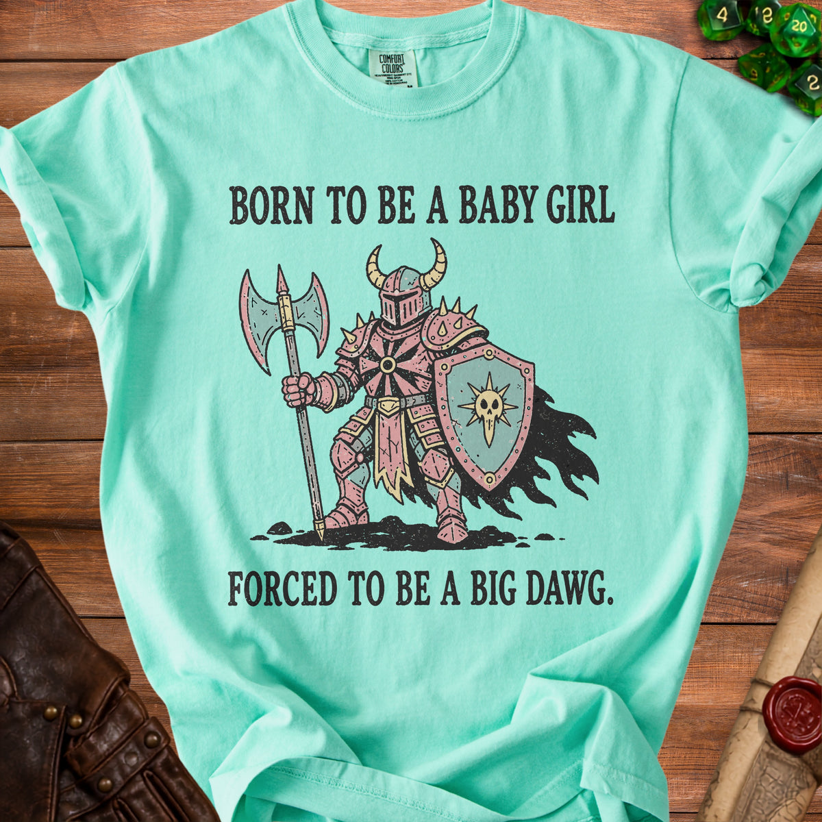 Mint t-shirt with knight graphic and text "Born to be a baby girl, forced to be a big dawg."