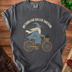 Wizard with cat on bicycle graphic on charcoal t-shirt with "My Familiar Called Shotgun" text.