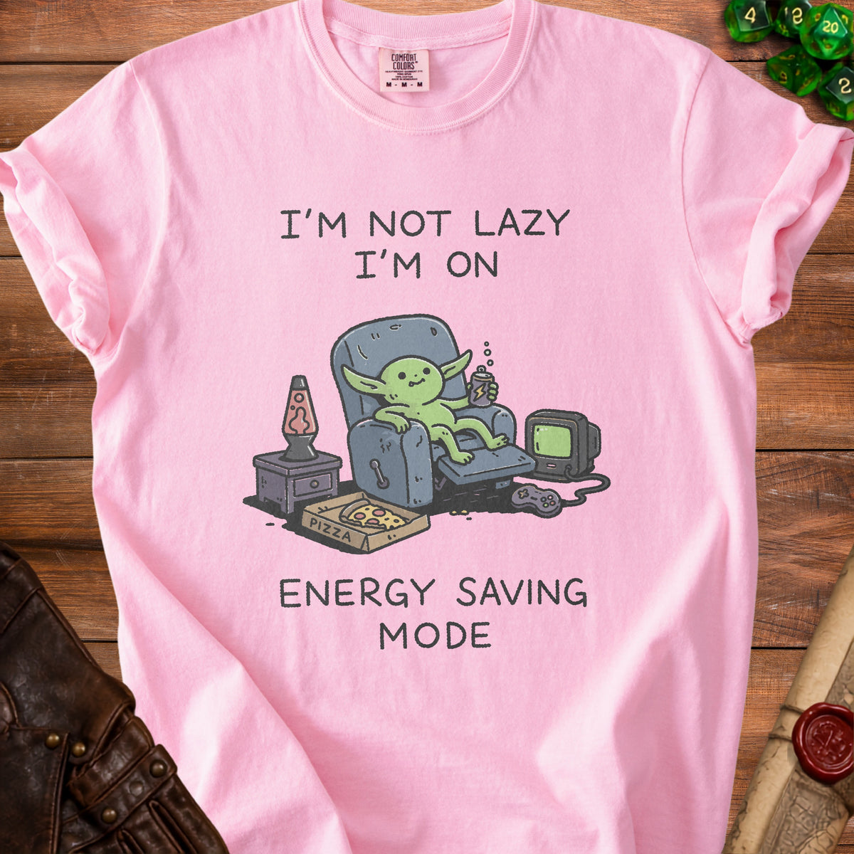 Pink t-shirt with cartoon of alien sitting in recliner, text "I'M NOT LAZY I'M ON ENERGY SAVING MODE".