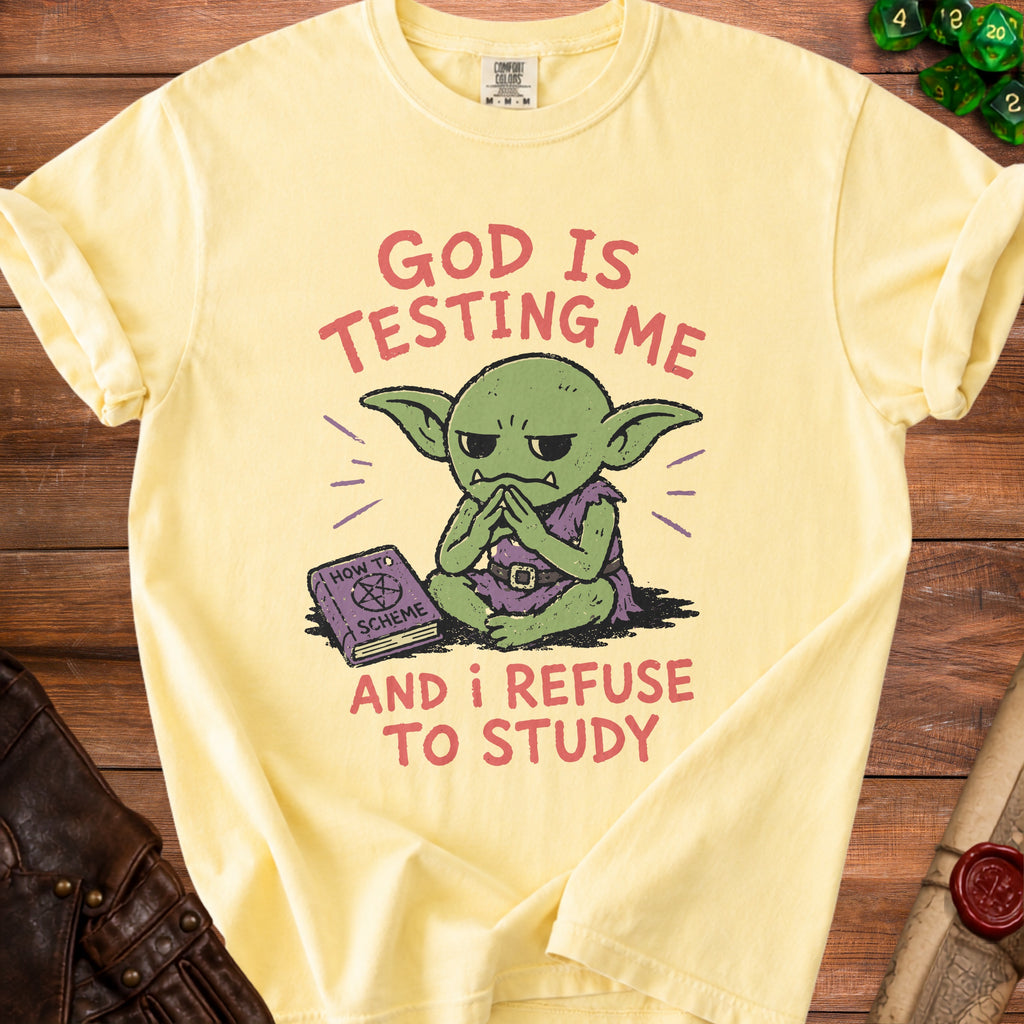 Yellow t-shirt with graphic of green goblin refusing to study a book.