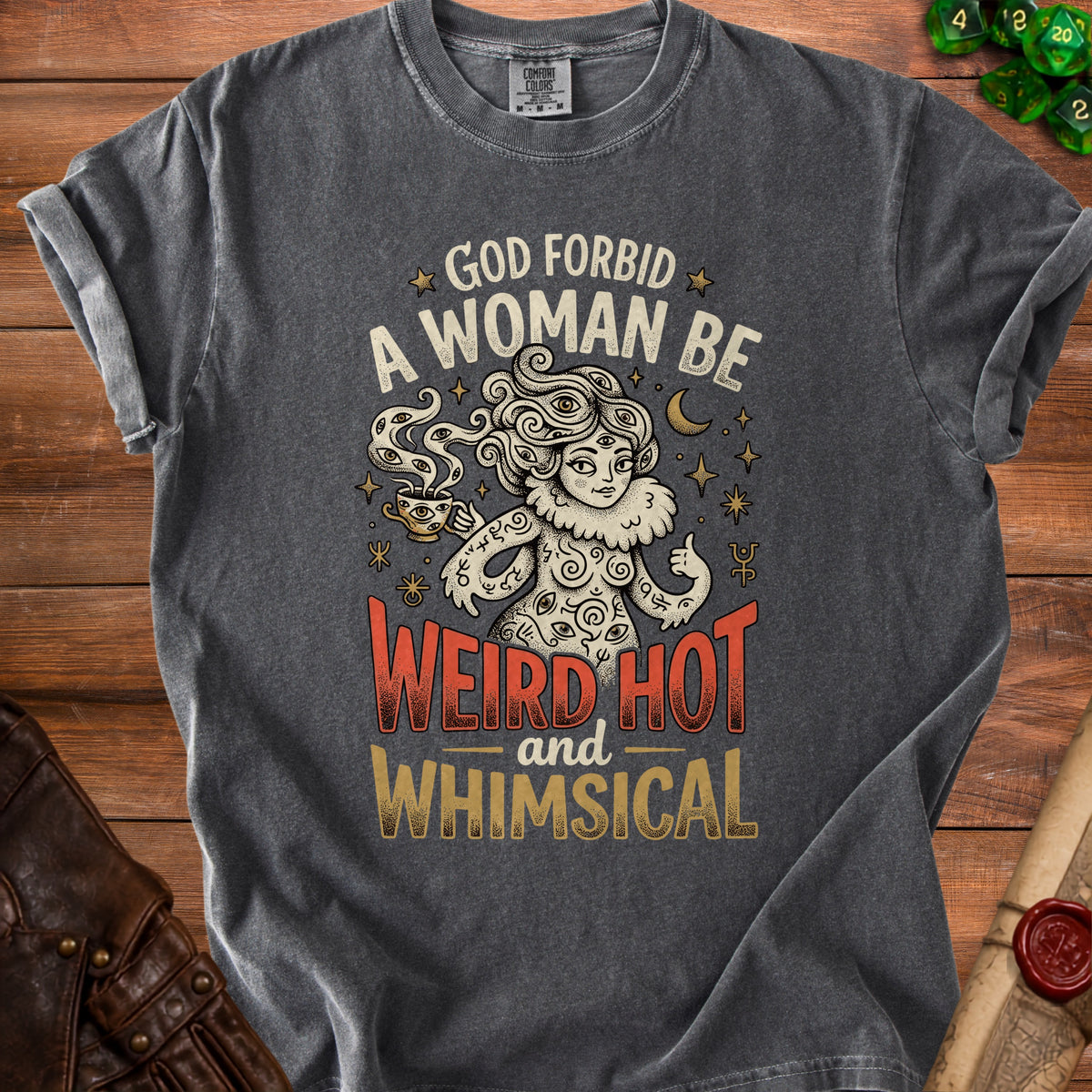 T-shirt with "God forbid a woman be weird hot and whimsical" text and mystical illustration.