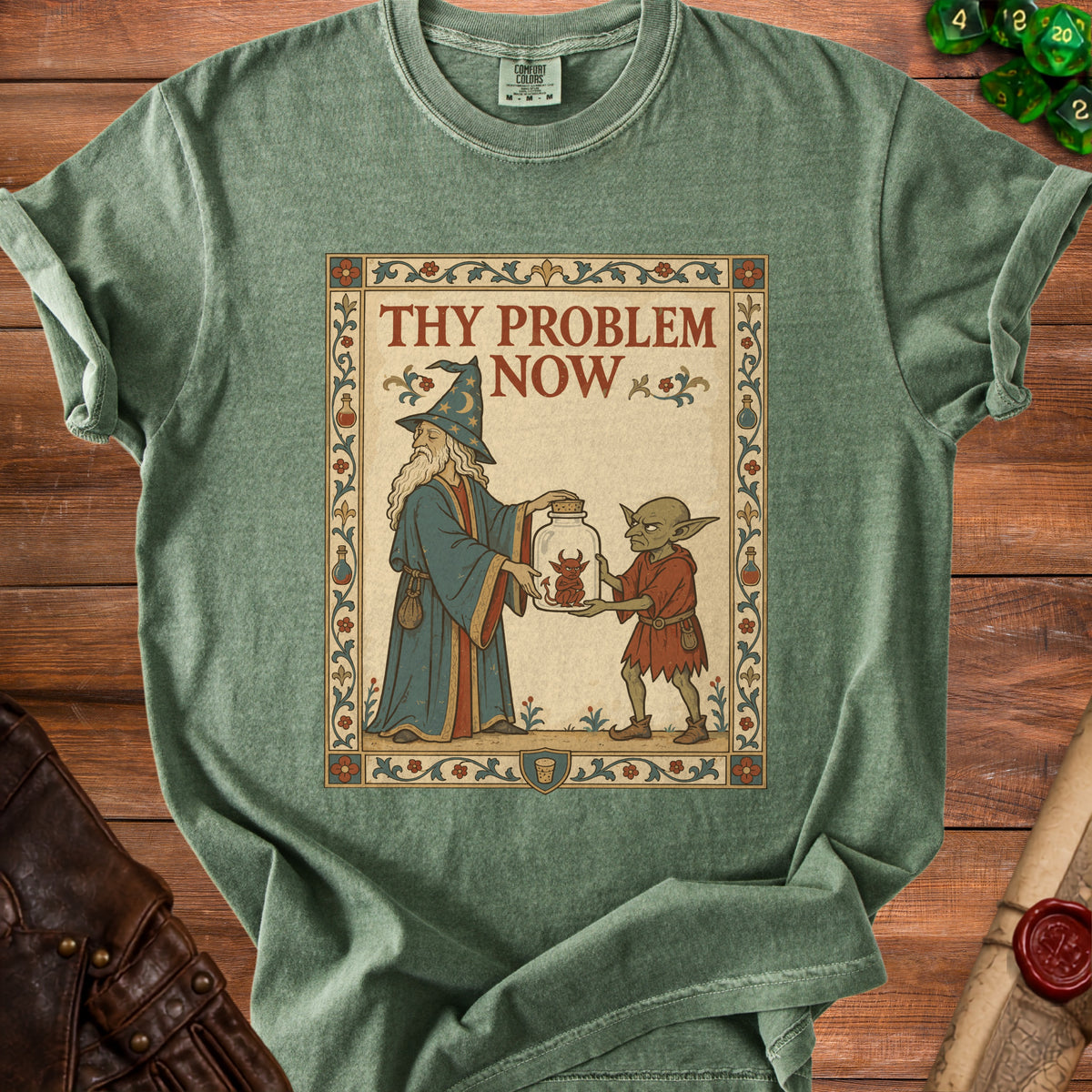 Green t-shirt featuring a wizard and goblin with text "Thy Problem Now".